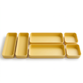 Six yellow organizer trays concept on white background