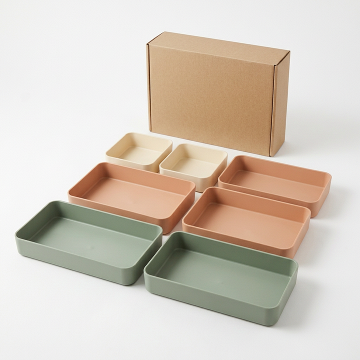 White-background concept image of seven trays and unprinted kraft packaging